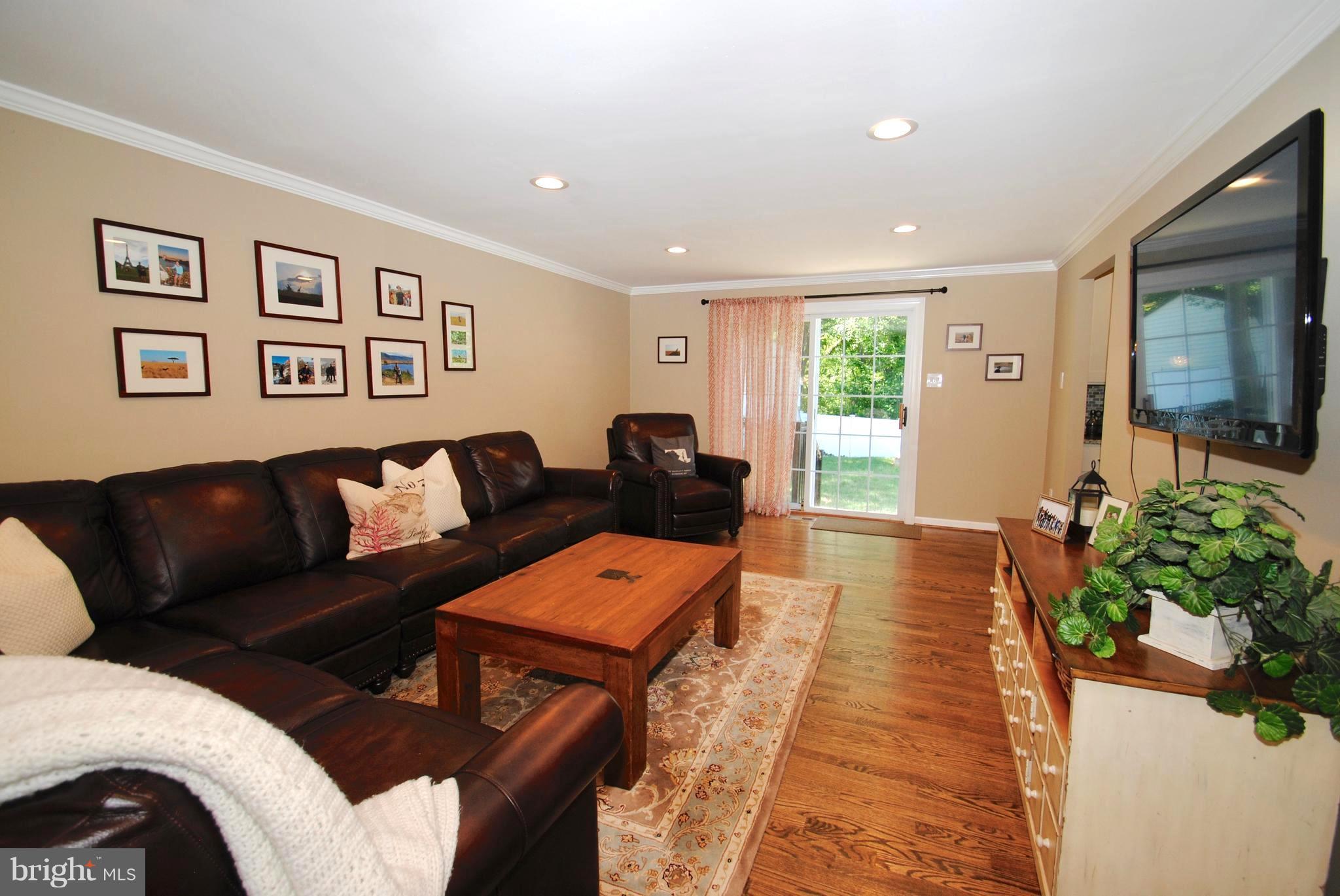 132 Church Road Arnold, MD 21012 - Photo 10 of 30 Living Room Opening to Patio / Recessed Lighting