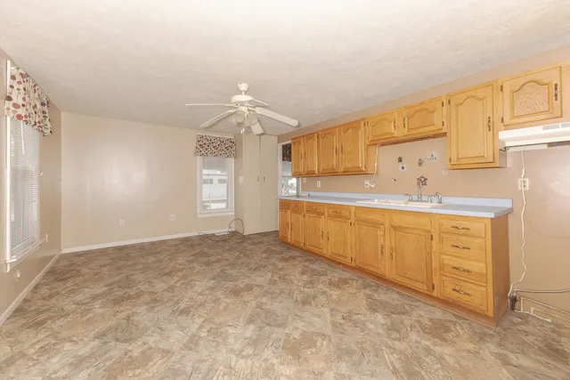 a bathroom with a sink a vanity and a mirror