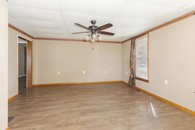 a view of an empty room with a window