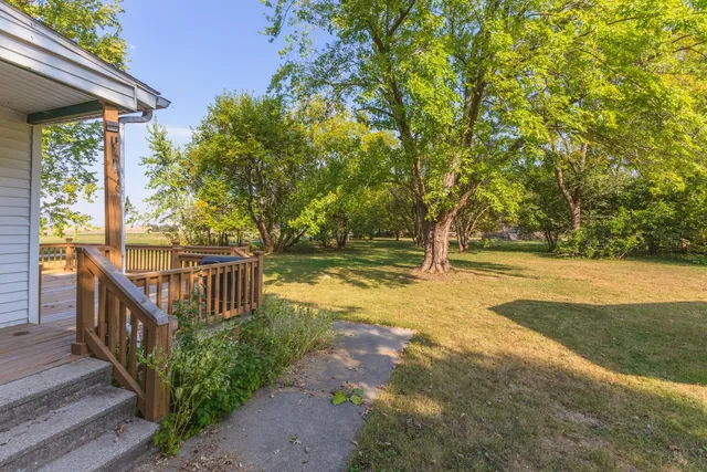 a view of a balcony with wooden floor