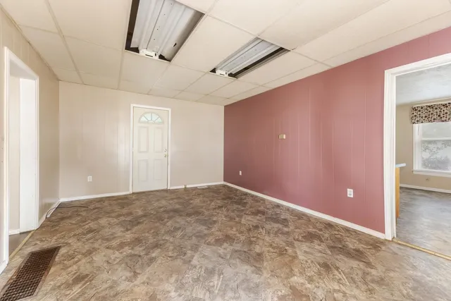 a view of an empty room with a window