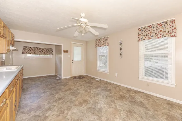 a spacious bathroom with a double vanity sink a mirror and a bathtub