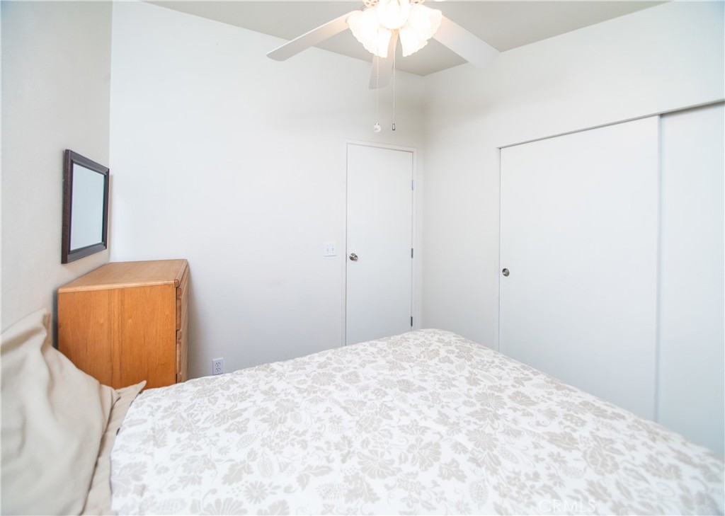 16390 Tish-A-Tang Road Lower Lake, CA 95457 - Photo 14 of 36 a bedroom with a bed and a mirror