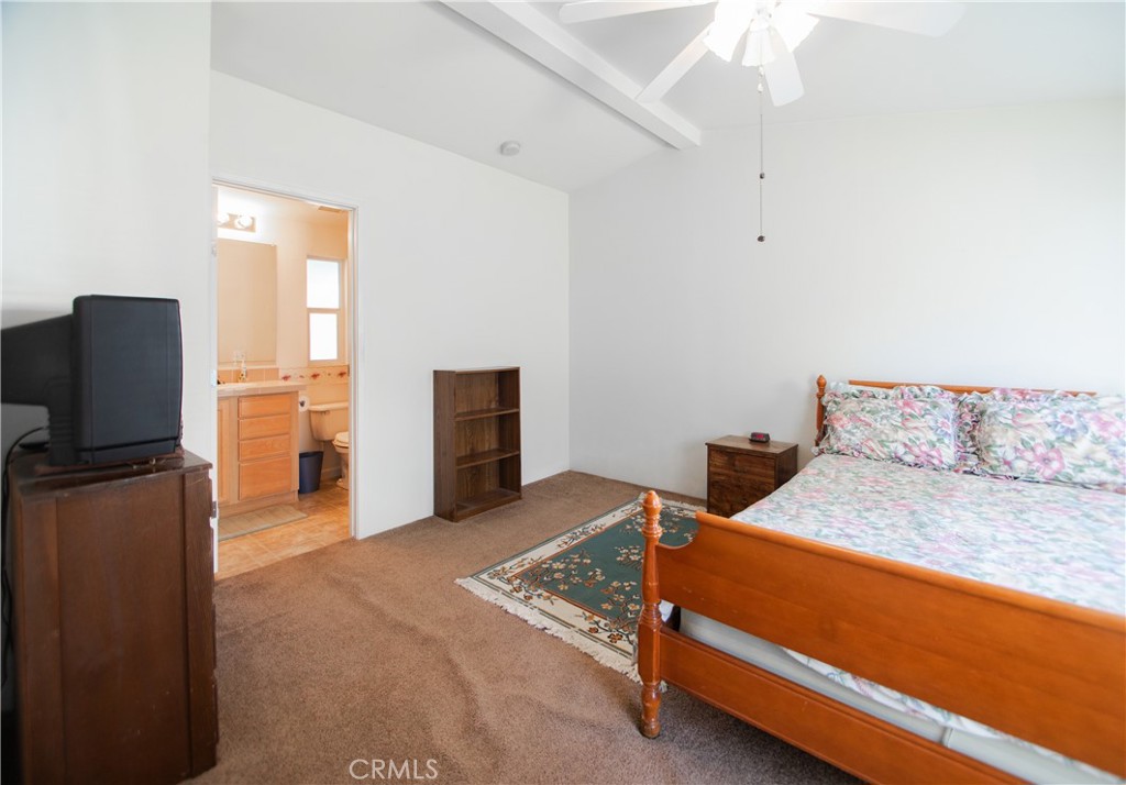 16390 Tish-A-Tang Road Lower Lake, CA 95457 - Photo 17 of 36 a bedroom with a bed and flat screen tv