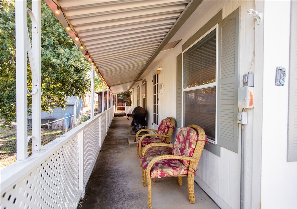 16390 Tish-A-Tang Road Lower Lake, CA 95457 - Photo 19 of 36 a balcony with furniture and a potted plant