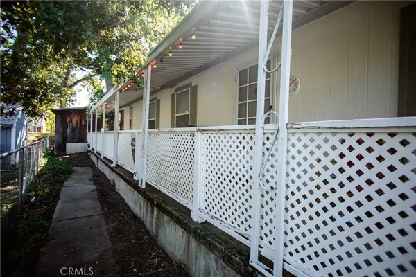 a view of a house with wooden fence
