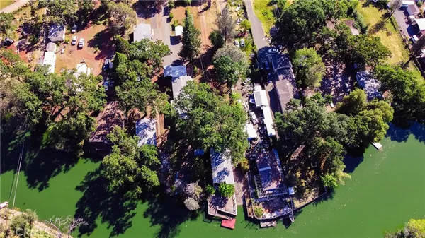 a view of an house with swimming pool garden and patio