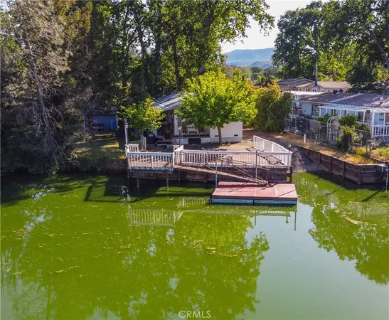 a view of a pathway of a house with a yard