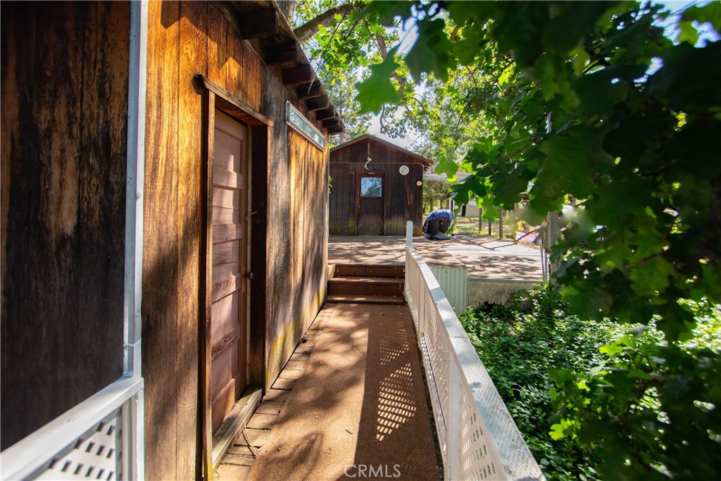 16390 Tish-A-Tang Road Lower Lake, CA 95457 - Photo 33 of 36 a view of a pathway of a house with a yard