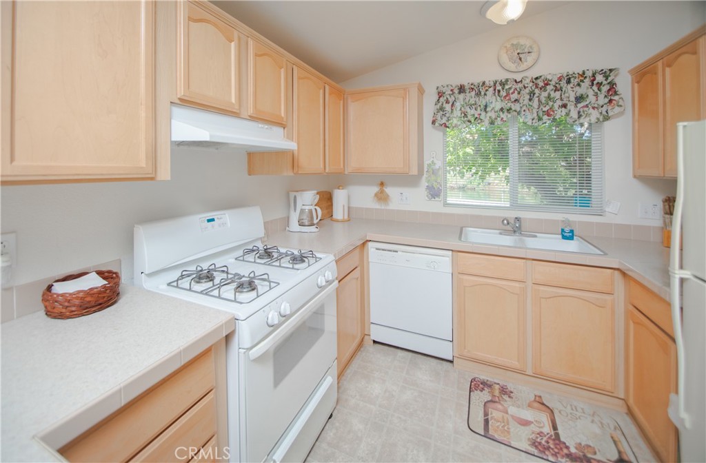 16390 Tish-A-Tang Road Lower Lake, CA 95457 - Photo 5 of 36 a kitchen with a sink stove and cabinets