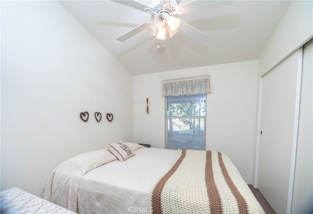 16390 Tish-A-Tang Road Lower Lake, CA 95457 - Photo 7 of 36 a bedroom with a bed and a chandelier