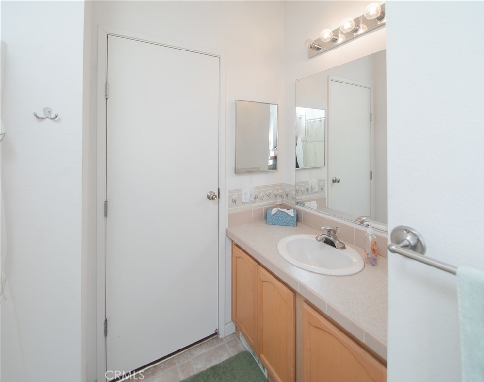 16390 Tish-A-Tang Road Lower Lake, CA 95457 - Photo 10 of 36 a bathroom with a sink and a mirror