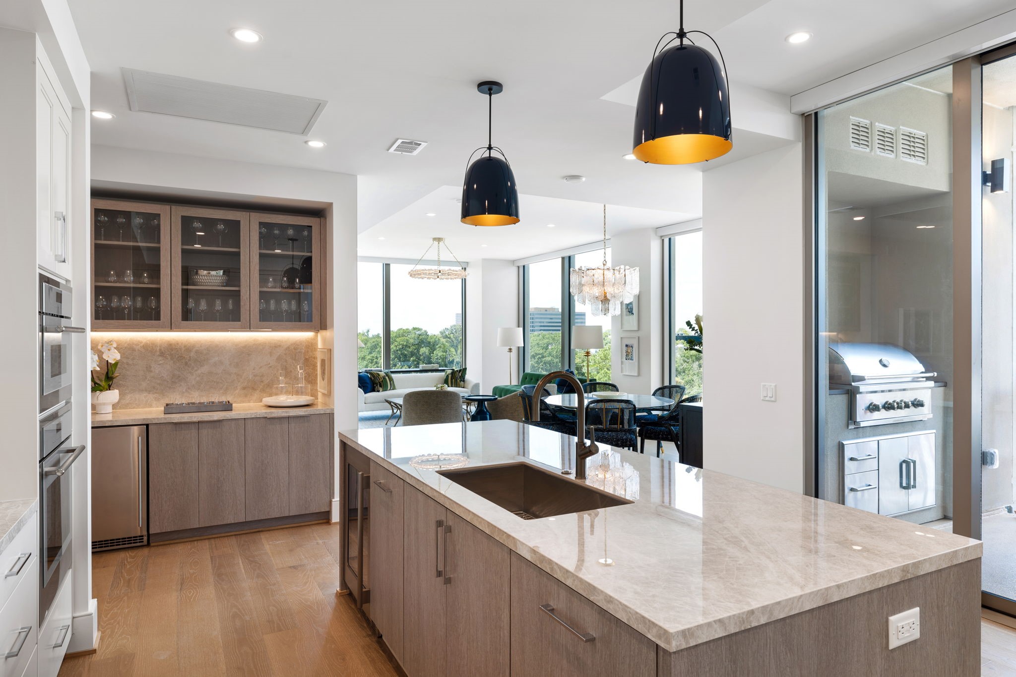 5656 San Felipe Street, Unit 1005 Houston, TX 77056 - Photo 6 of 33 The kitchen effortlessly flows into the private balcony with built-in gas grill station and pretty East views.