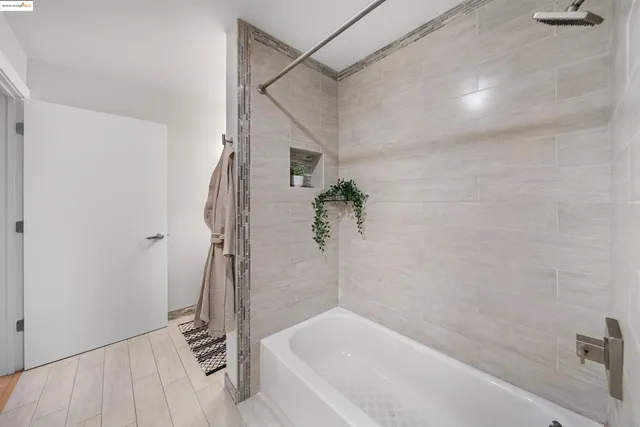 a bathroom with a bathtub and shower