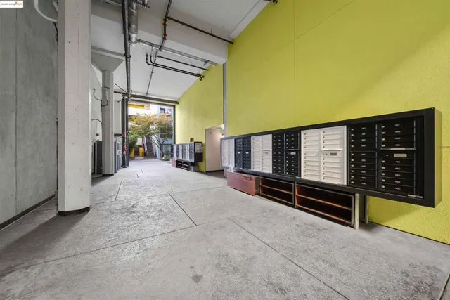 a view of a patio with a table and chairs