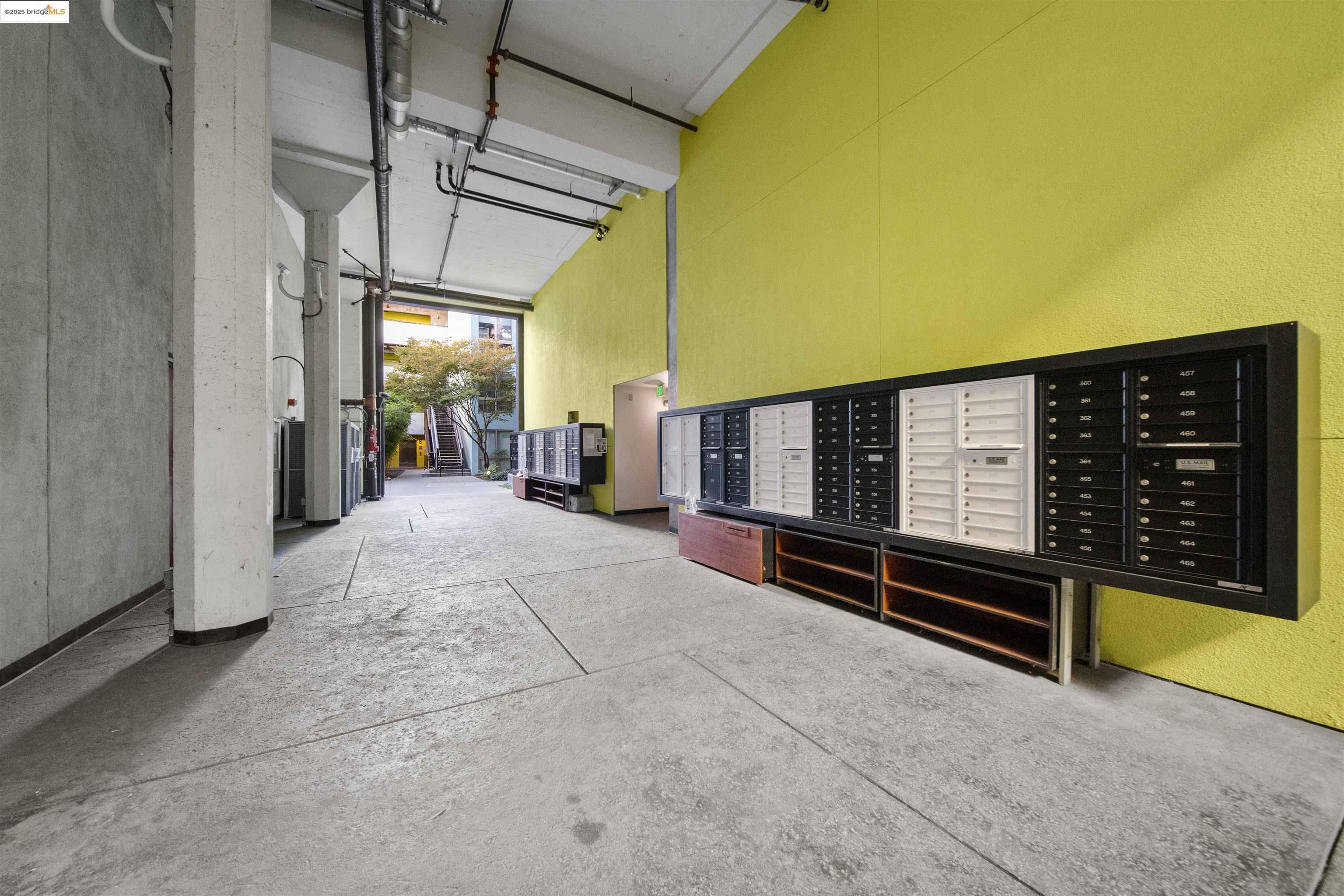 1201 Pine Street, Unit 363 Oakland, CA 94607 - Photo 18 of 25 a view of a patio with a table and chairs