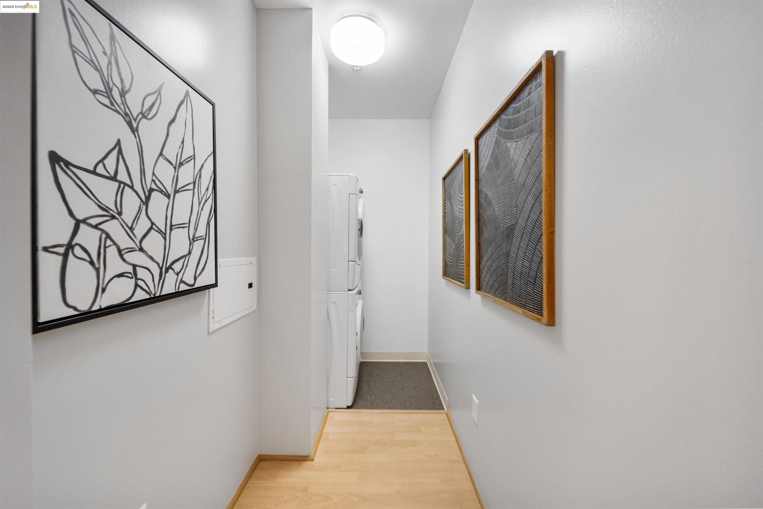 1201 Pine Street, Unit 363 Oakland, CA 94607 - Photo 7 of 25 a view of a hallway with wooden floor and staircase