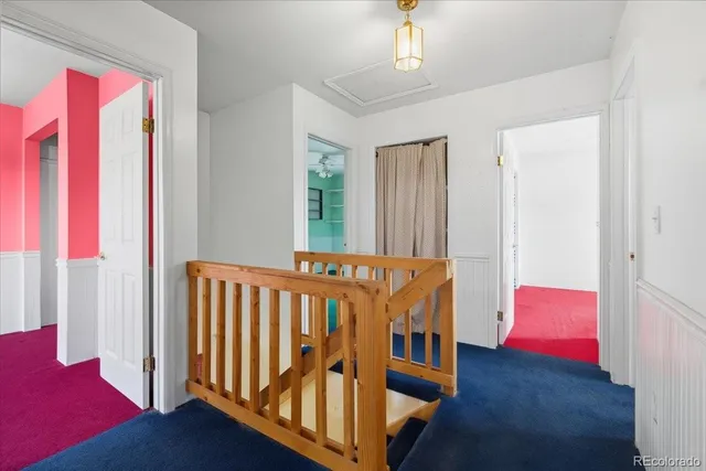 a view of a bedroom with furniture and staircase