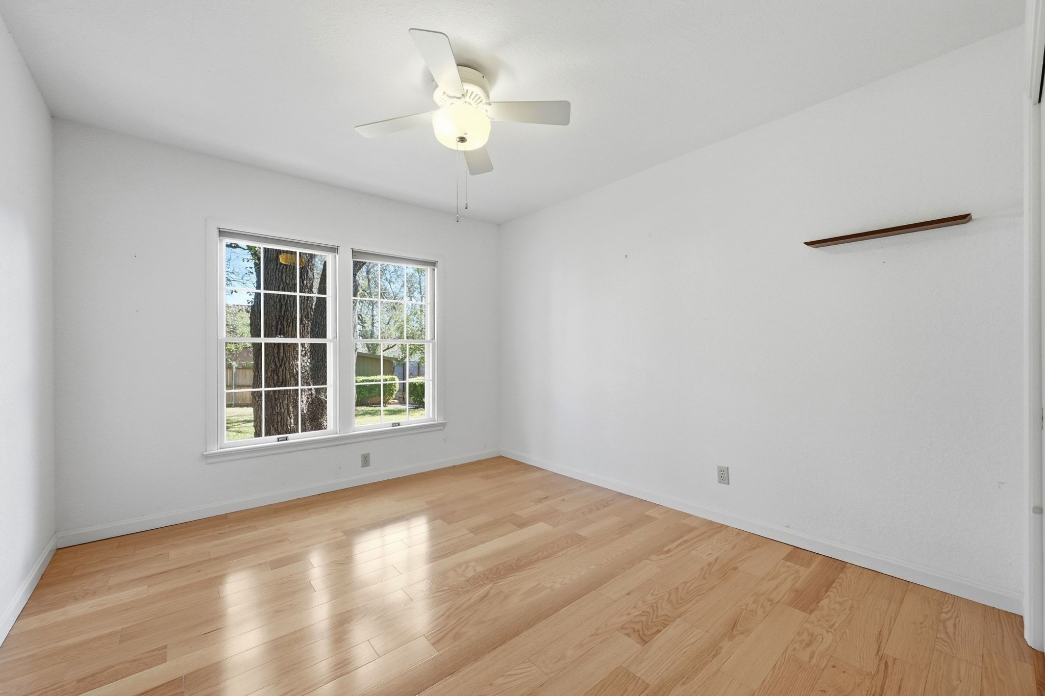 405 Ridgewood Road Austin, TX 78746 - Photo 17 of 32 Bedroom 3 - Each bedroom offers hardwood flooring, eliminating carpet in the home.