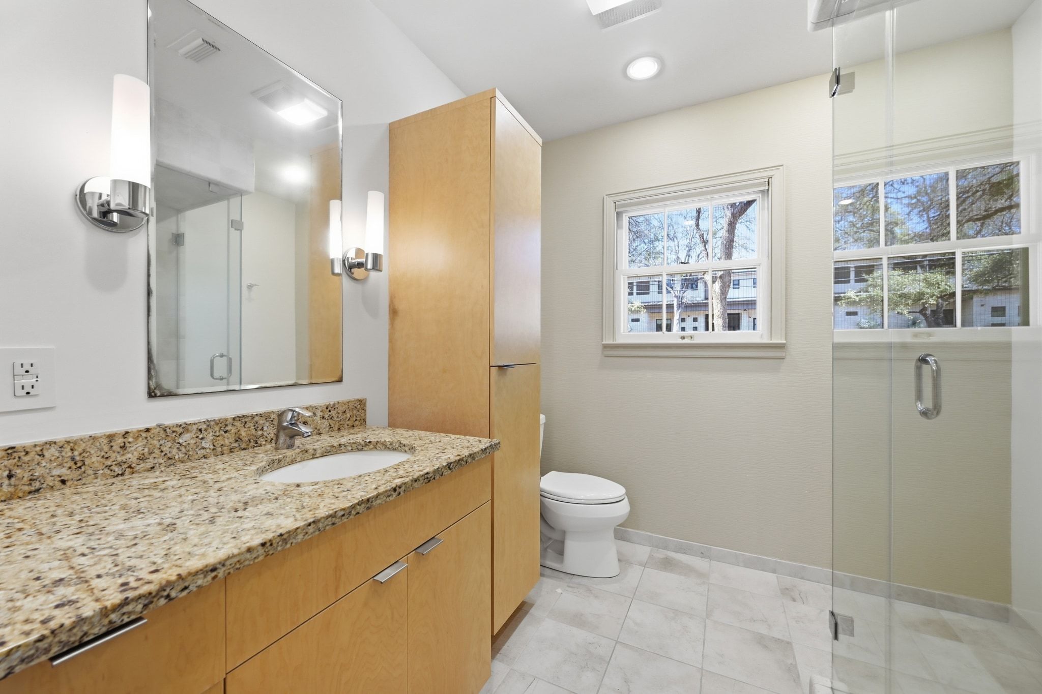 405 Ridgewood Road Austin, TX 78746 - Photo 18 of 32 The second full bath has been updated with a steam shower for ultimate relaxation.