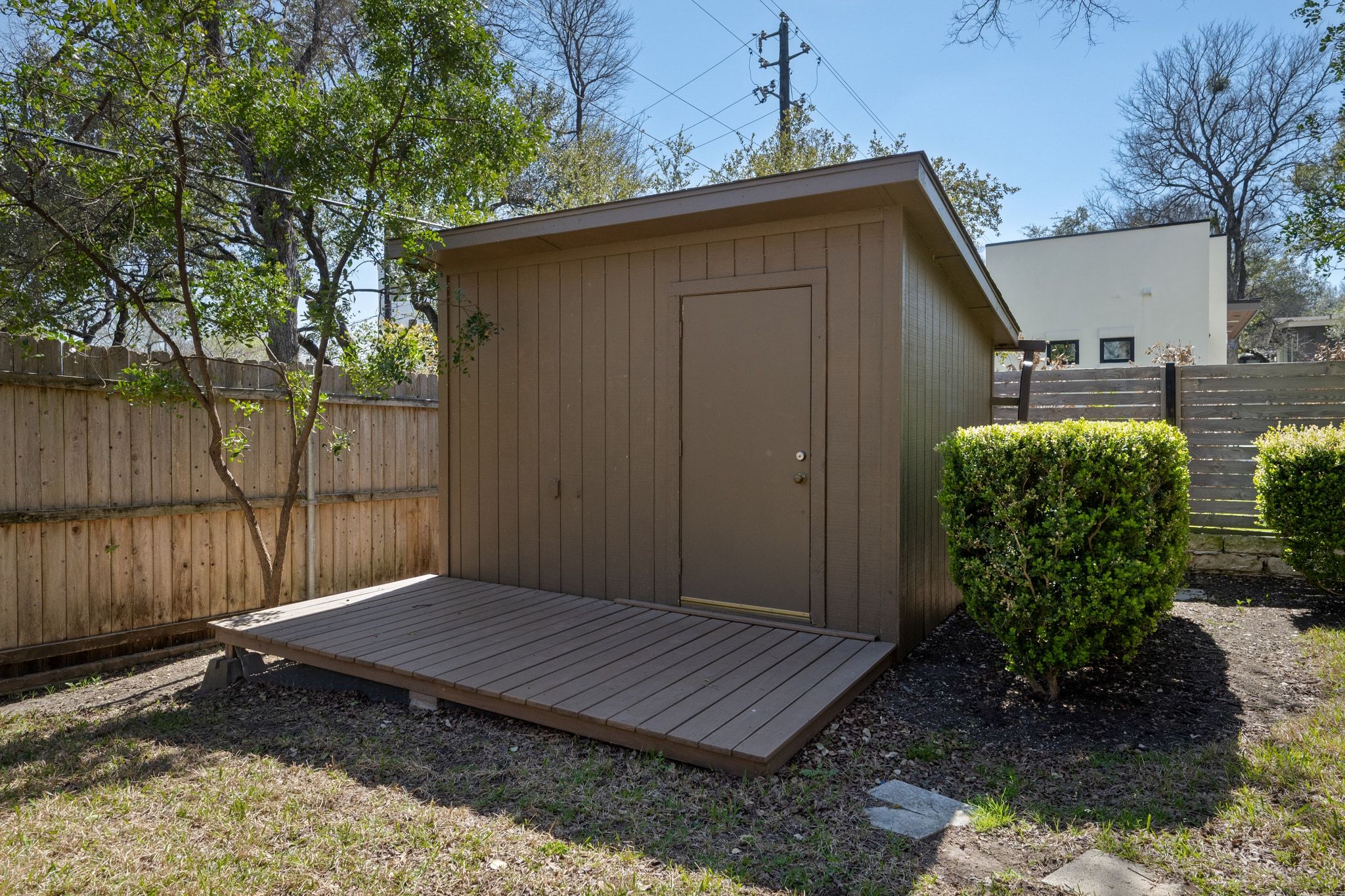 405 Ridgewood Road Austin, TX 78746 - Photo 22 of 32 The backyard offers a detached workshed.