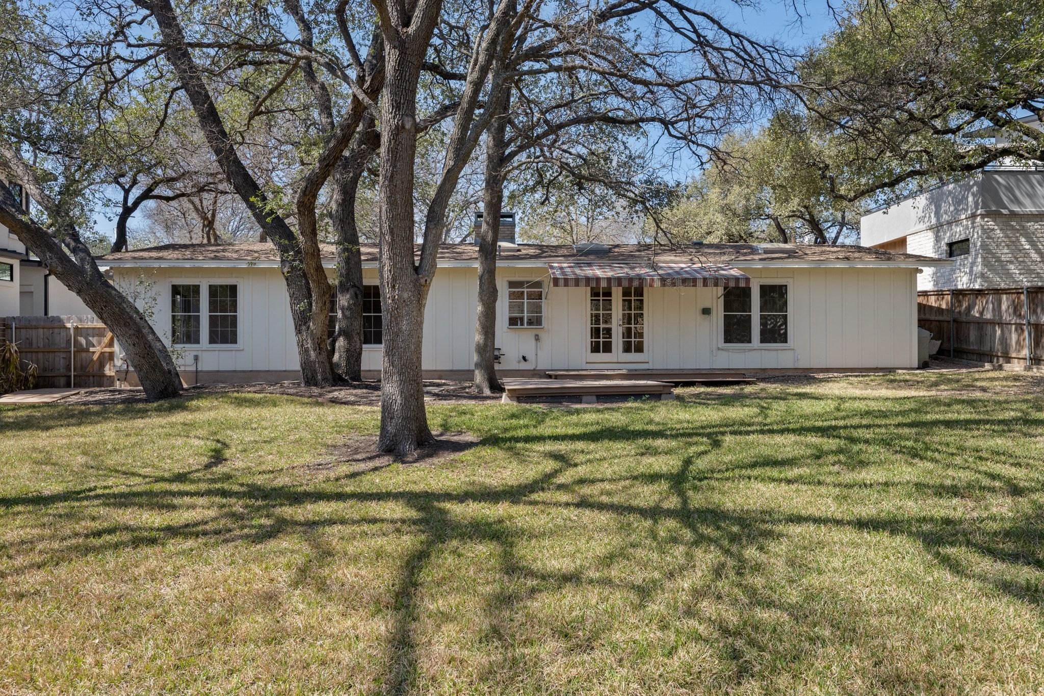 405 Ridgewood Road Austin, TX 78746 - Photo 26 of 32 Matures trees create a canopy over the backyard.