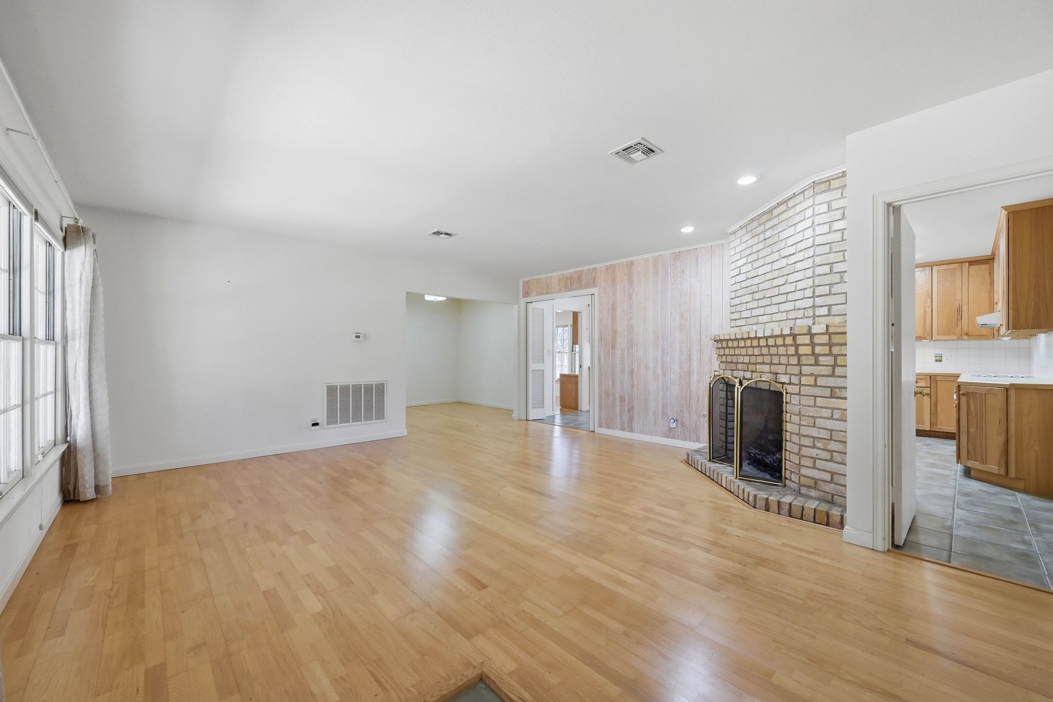 405 Ridgewood Road Austin, TX 78746 - Photo 5 of 32 Hardwood flooring adds character to the existing home.