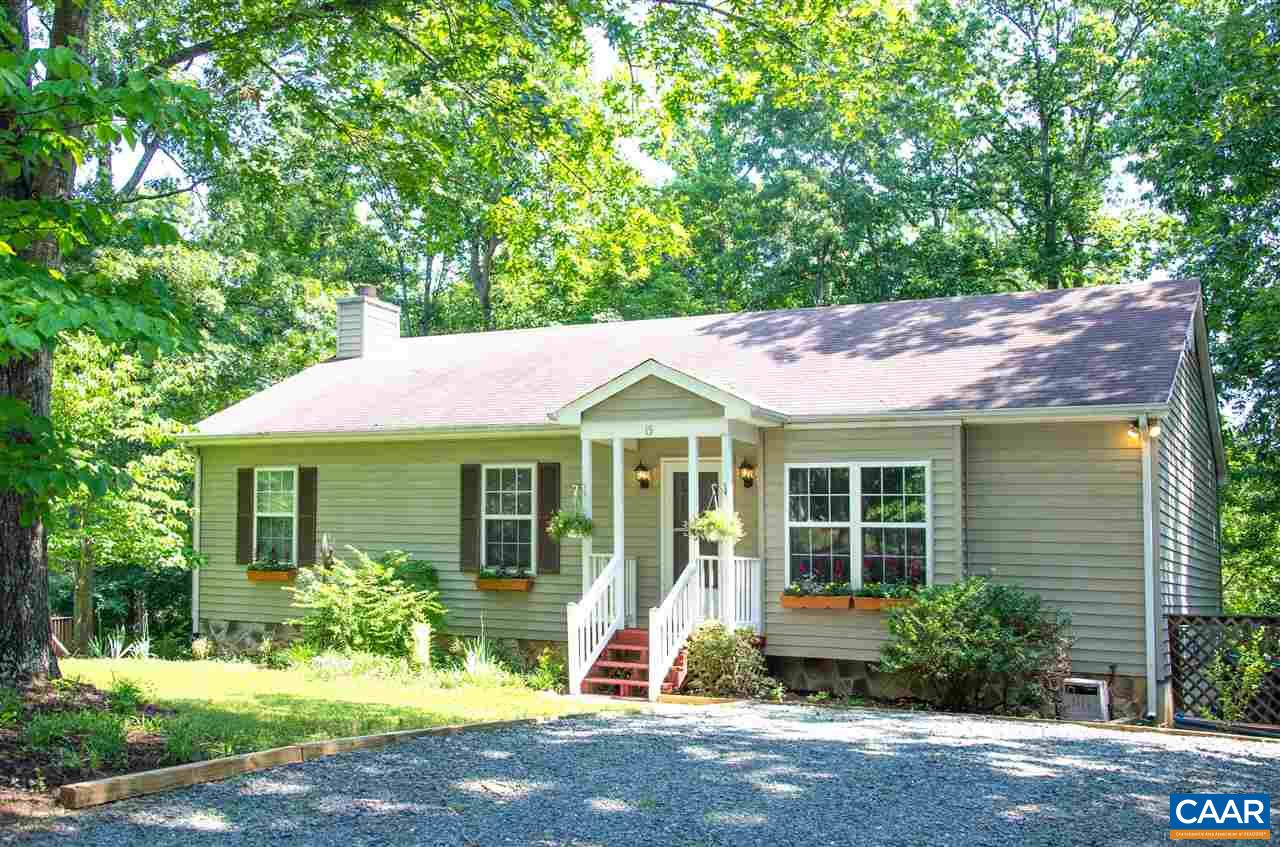 15 Ashton Road Palmyra, VA 22963 - Photo 46 of 50 a small yard in front of a brick house with potted plants