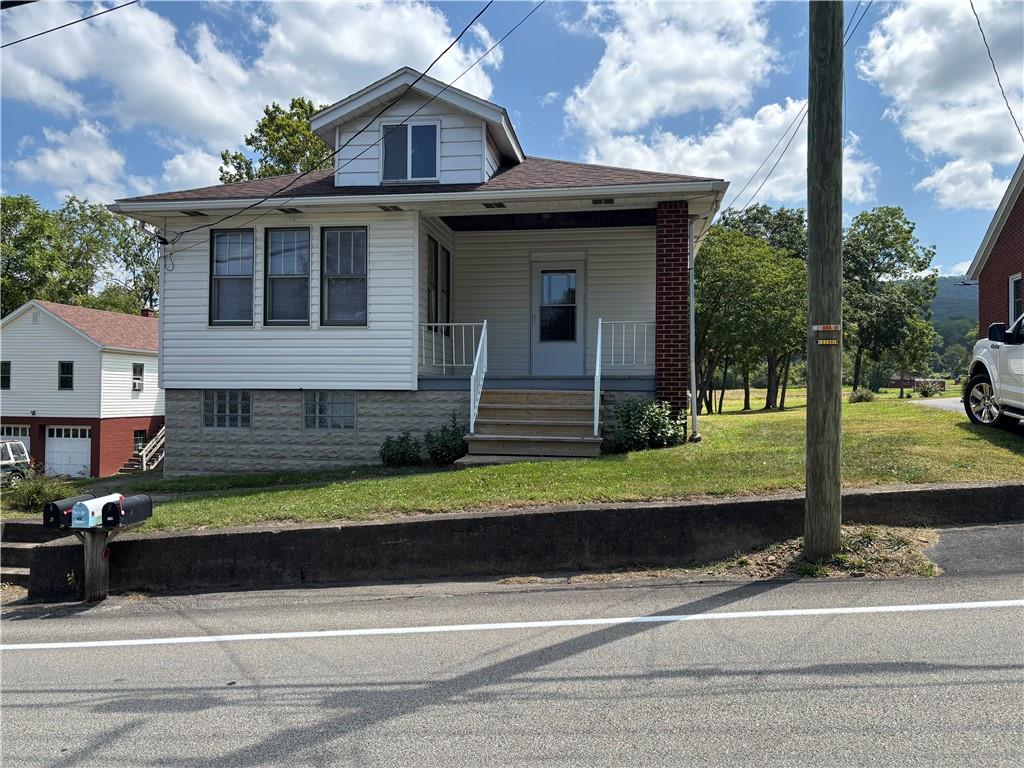264 Hopwood Fairchance Road Uniontown, PA 15401 - Photo 1 of 19 a front view of a house with a yard and garage