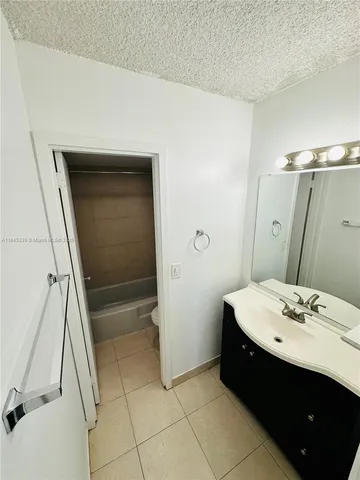 a bathroom with a sink a vanity and a mirror