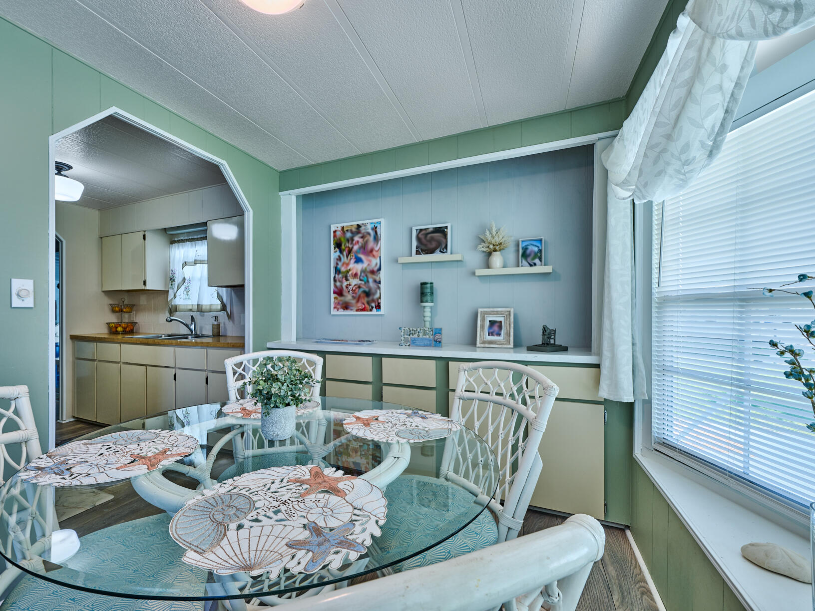 6977 Southeast Delegate Street Hobe Sound, FL 33455 - Photo 21 of 60 a living room with furniture and a table
