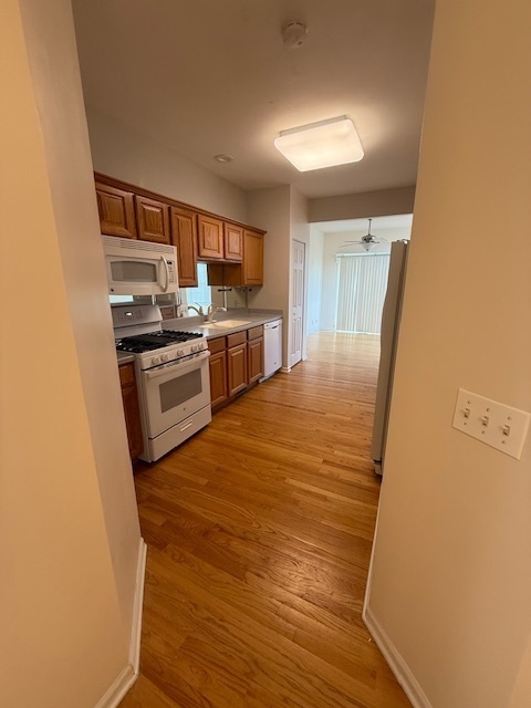 272 Bay Drive Itasca, IL 60143 - Photo 30 of 49 a kitchen with stainless steel appliances granite countertop a stove and a refrigerator