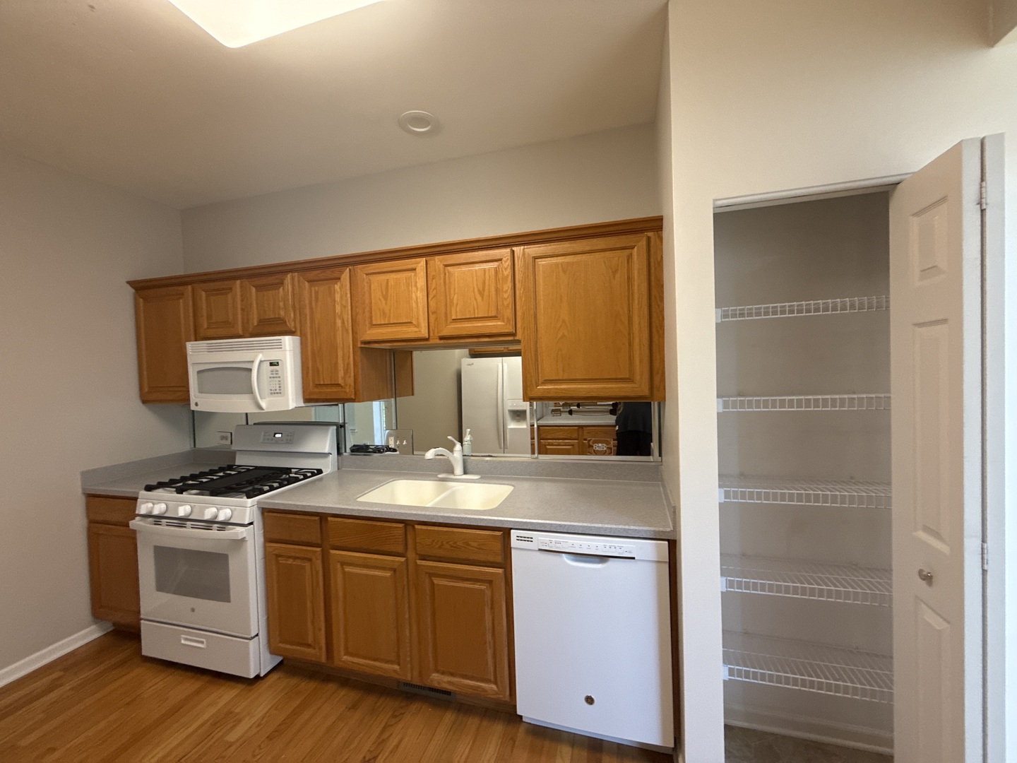 272 Bay Drive Itasca, IL 60143 - Photo 32 of 49 a kitchen with stainless steel appliances granite countertop a stove a sink and a refrigerator