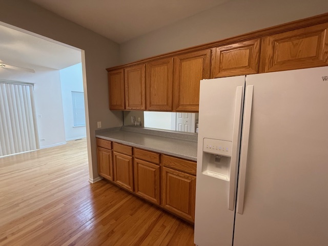 272 Bay Drive Itasca, IL 60143 - Photo 33 of 49 a kitchen with granite countertop a refrigerator and a sink