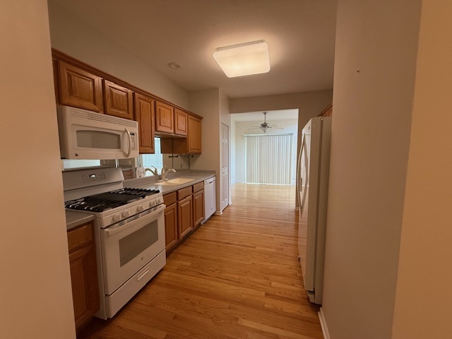 272 Bay Drive Itasca, IL 60143 - Photo 34 of 49 a kitchen with stainless steel appliances granite countertop a stove a sink and a refrigerator