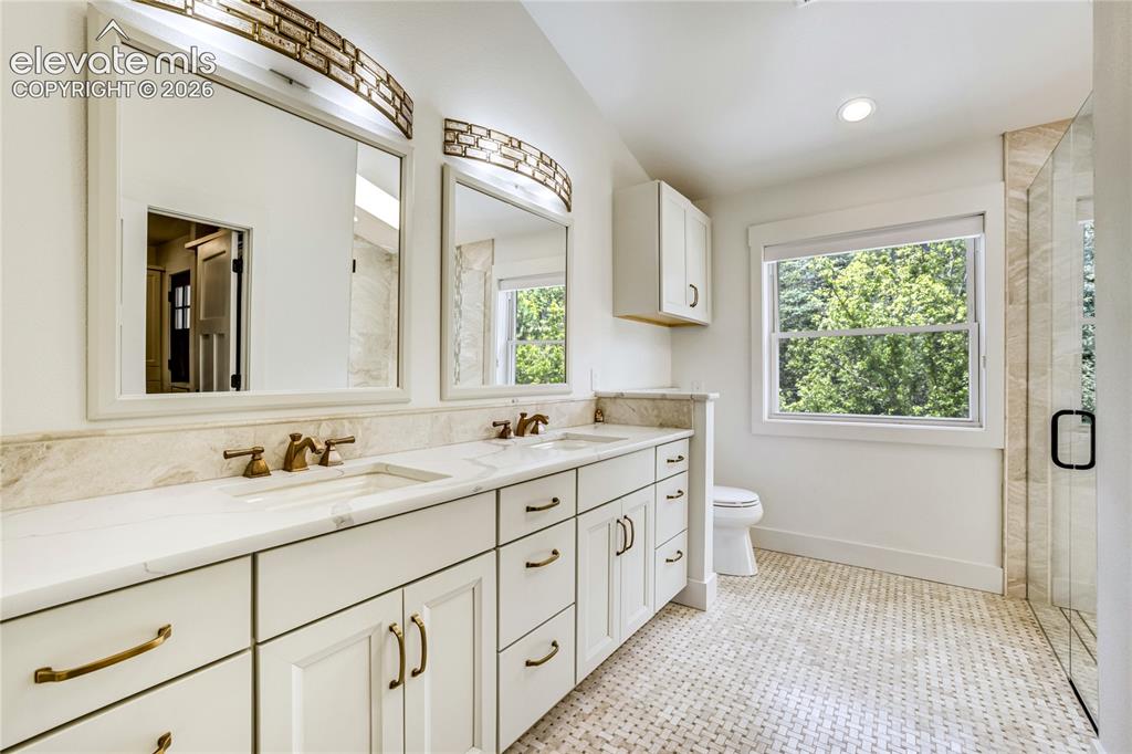 3 Thayer Road Colorado Springs, CO 80906 - Photo 30 of 50 Spa-inspired luxury featuring heated floors, designer finishes, and a spacious walk-in shower.