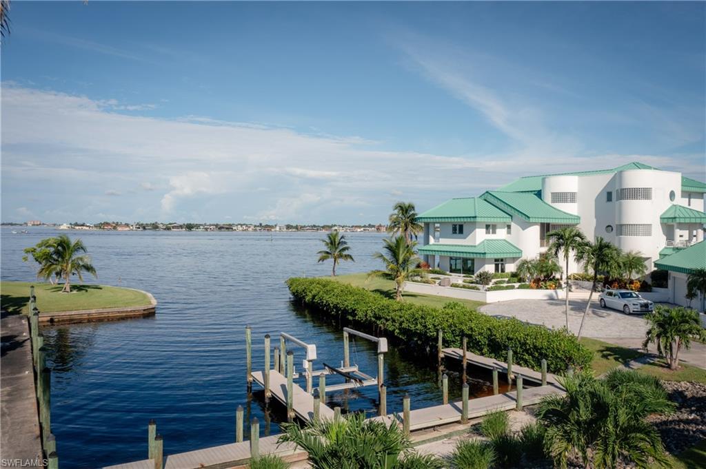 14040 Schultz Road Fort Myers, FL 33908 - Photo 43 of 48 Water view with a dock and boat lift