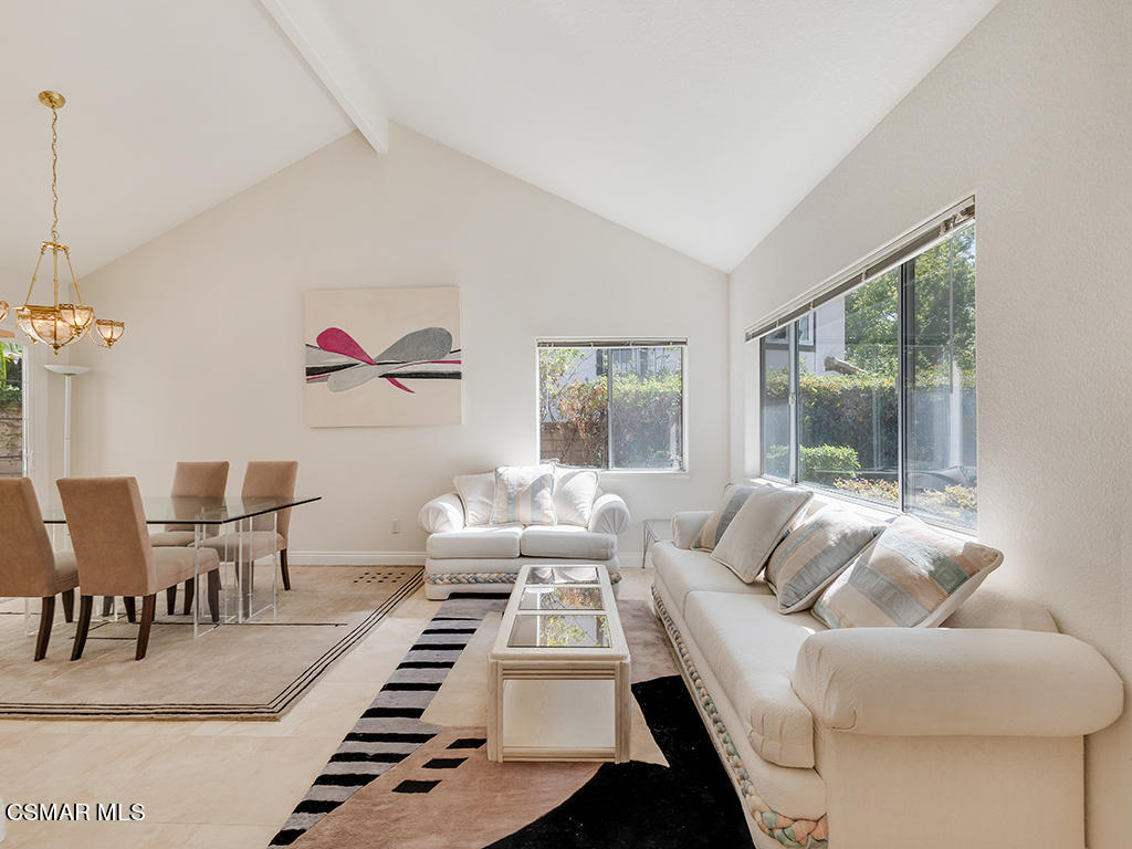 5218 Indian Hills Drive Simi Valley, CA 93063 - Photo 11 of 44 a living room with furniture a rug and a floor to ceiling window