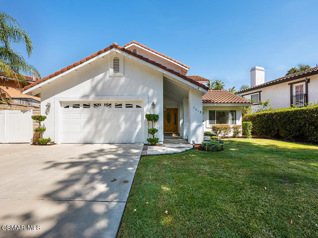 5218 Indian Hills Drive Simi Valley, CA 93063 - Photo 18 of 44 a front view of a house with a garden
