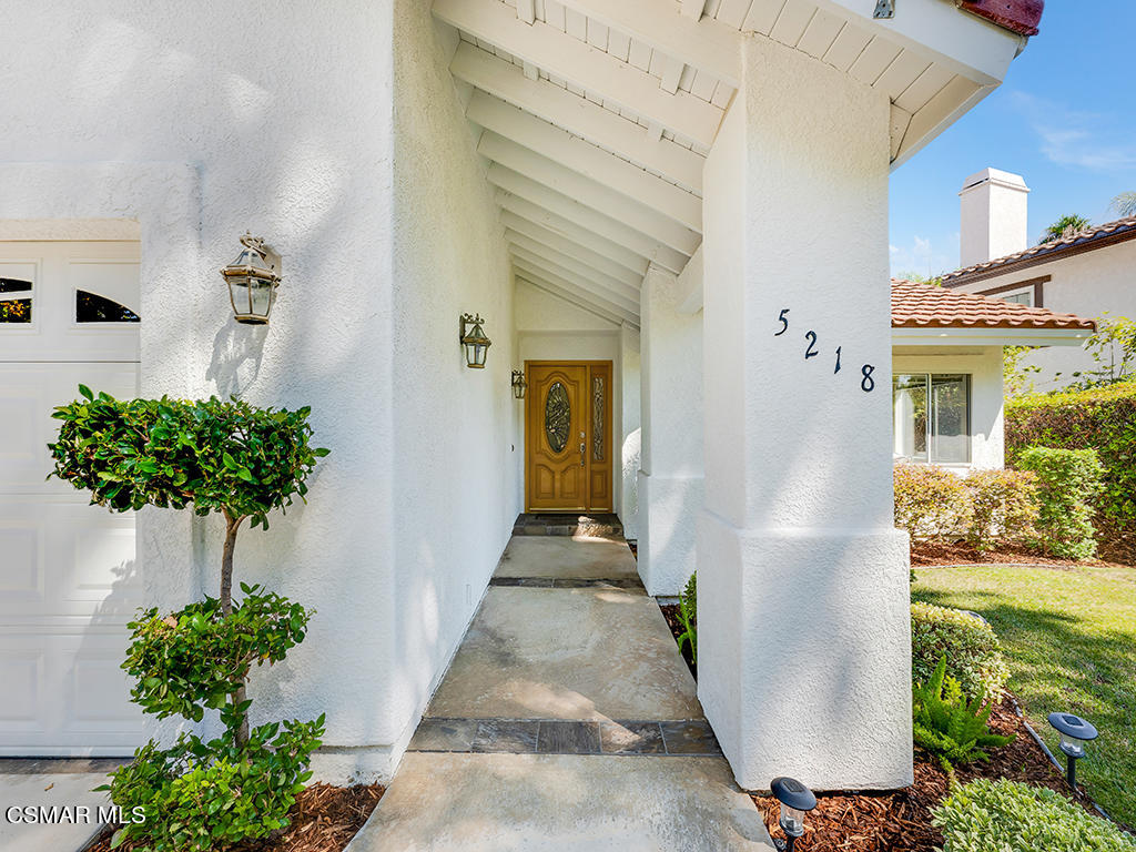 5218 Indian Hills Drive Simi Valley, CA 93063 - Photo 19 of 44 a front view of a house with a yard