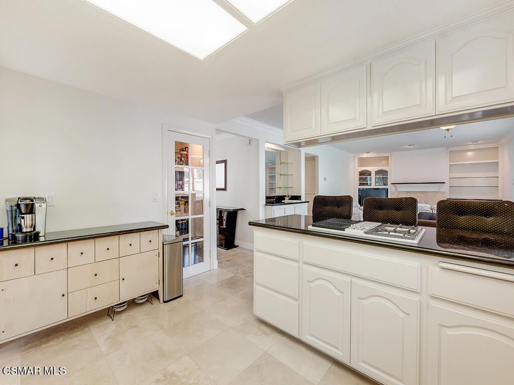 5218 Indian Hills Drive Simi Valley, CA 93063 - Photo 25 of 44 a large white kitchen with cabinets
