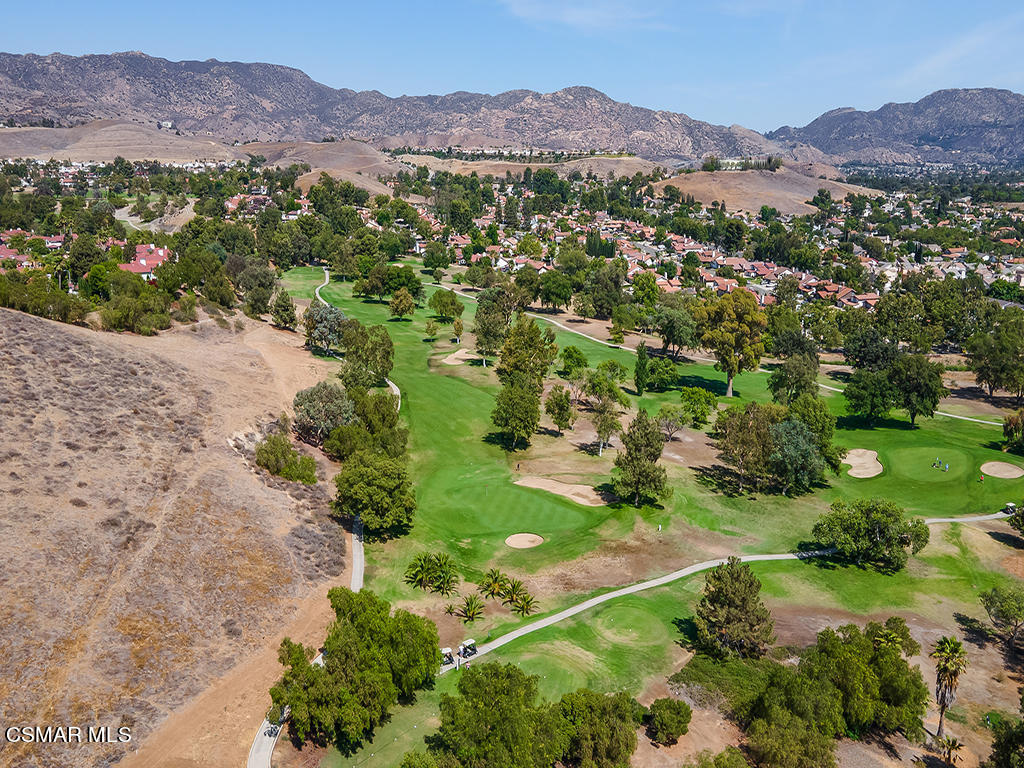 5218 Indian Hills Drive Simi Valley, CA 93063 - Photo 40 of 44 a view of a lush green hillside and houses