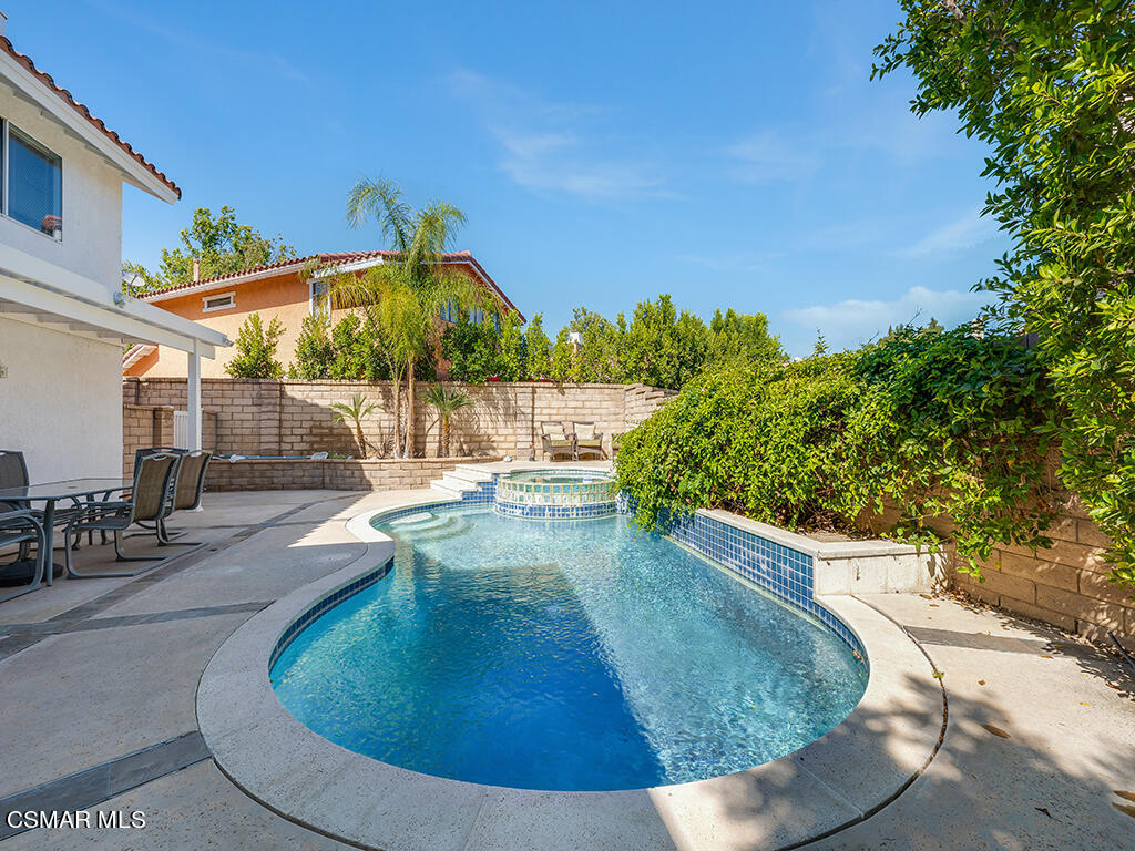 5218 Indian Hills Drive Simi Valley, CA 93063 - Photo 8 of 44 a view of a swimming pool with a patio