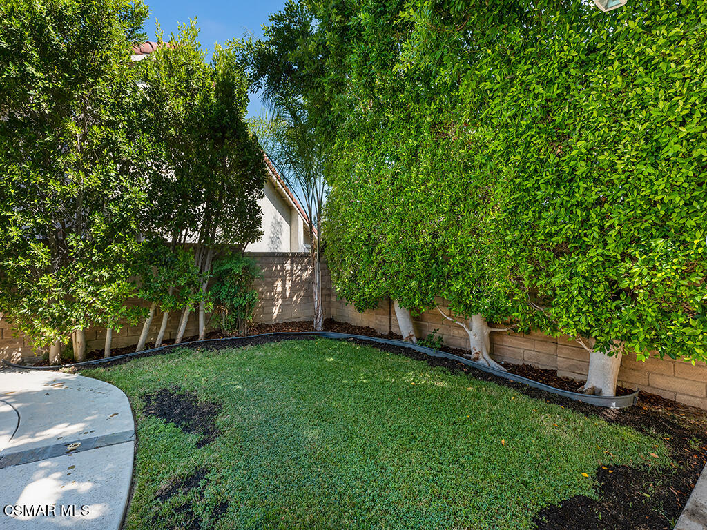 5218 Indian Hills Drive Simi Valley, CA 93063 - Photo 9 of 44 a view of a backyard with a garden