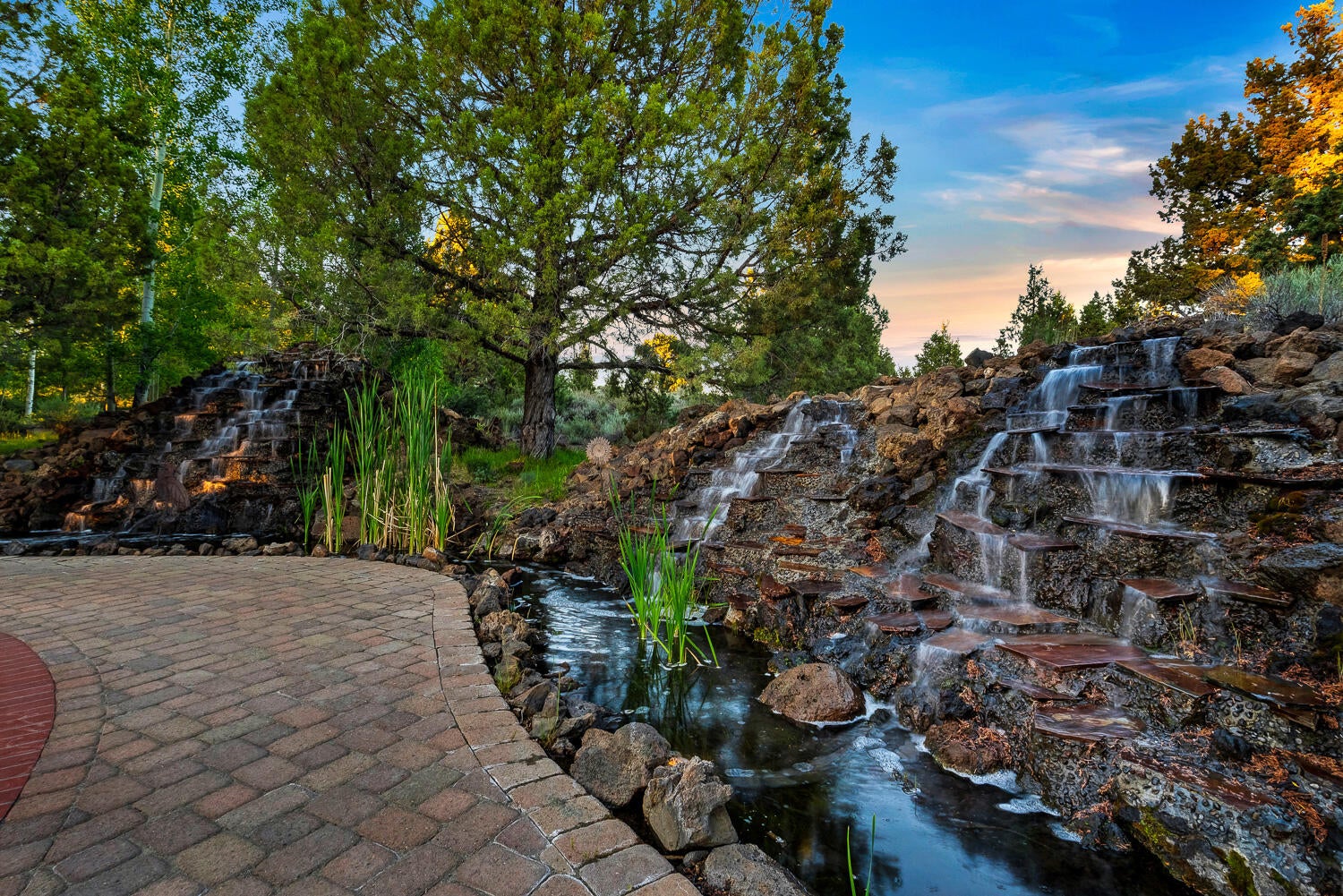 60470 Arnold Market Road Bend, OR 97702 - Photo 34 of 53 This cascading water feature is beautiful at all times of day.