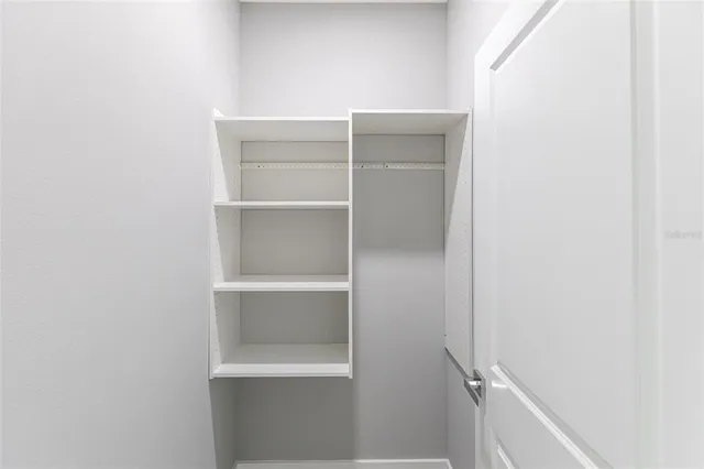 a view of an empty walk in closet