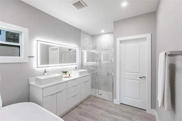 a bathroom with a sink toilet and mirror
