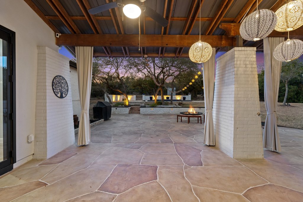 4018 Bee Creek Road Spicewood, TX 78669 - Photo 11 of 40 Spacious patio ideal for grilling, entertaining, and outdoor living.