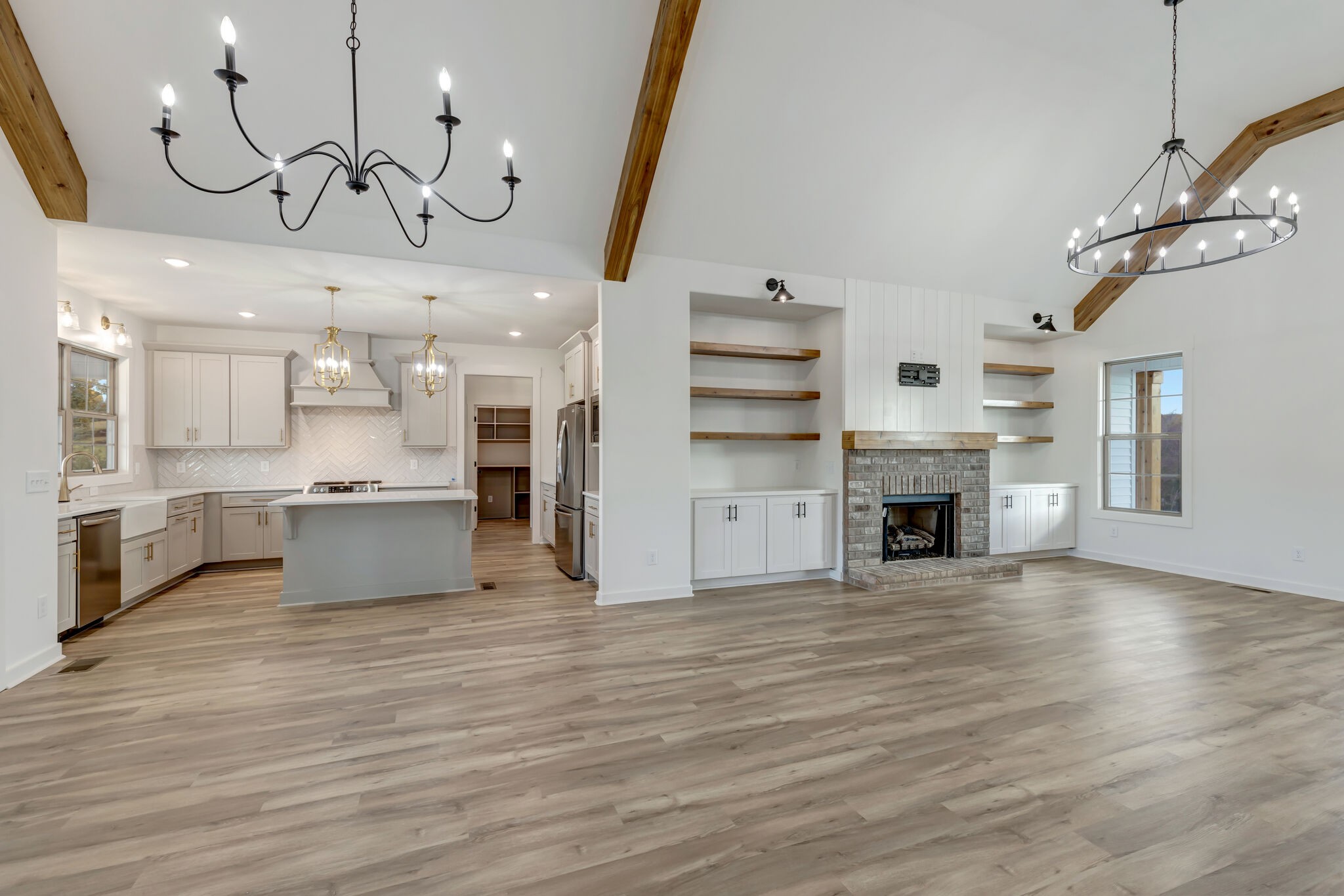 1 Hunter Bills Road Lewisburg, TN 37091 - Photo 11 of 48 a view of a kitchen with granite countertop a stove top oven a sink and a chandelier