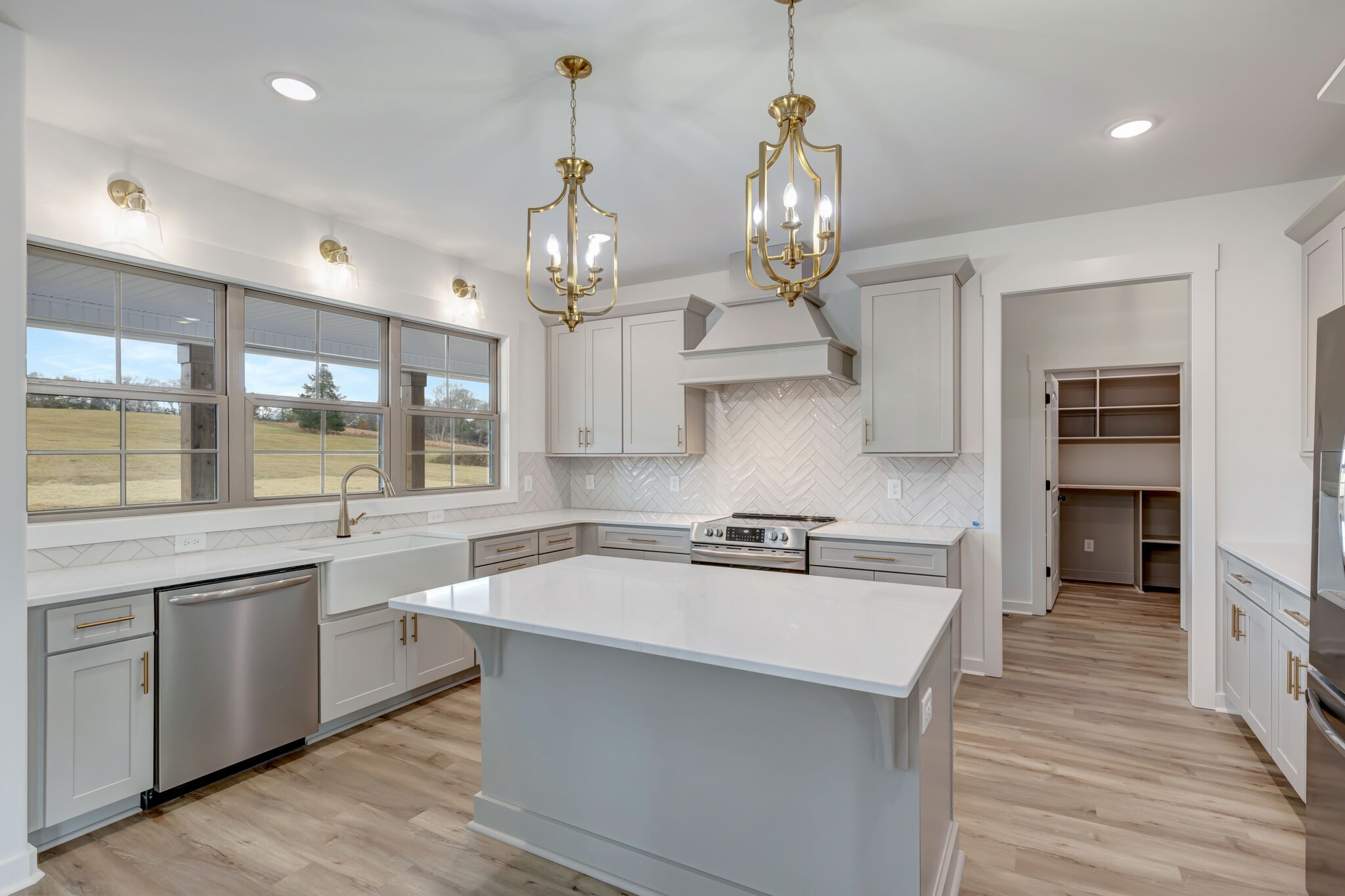 1 Hunter Bills Road Lewisburg, TN 37091 - Photo 17 of 48 a large kitchen with kitchen island a sink stainless steel appliances and cabinets